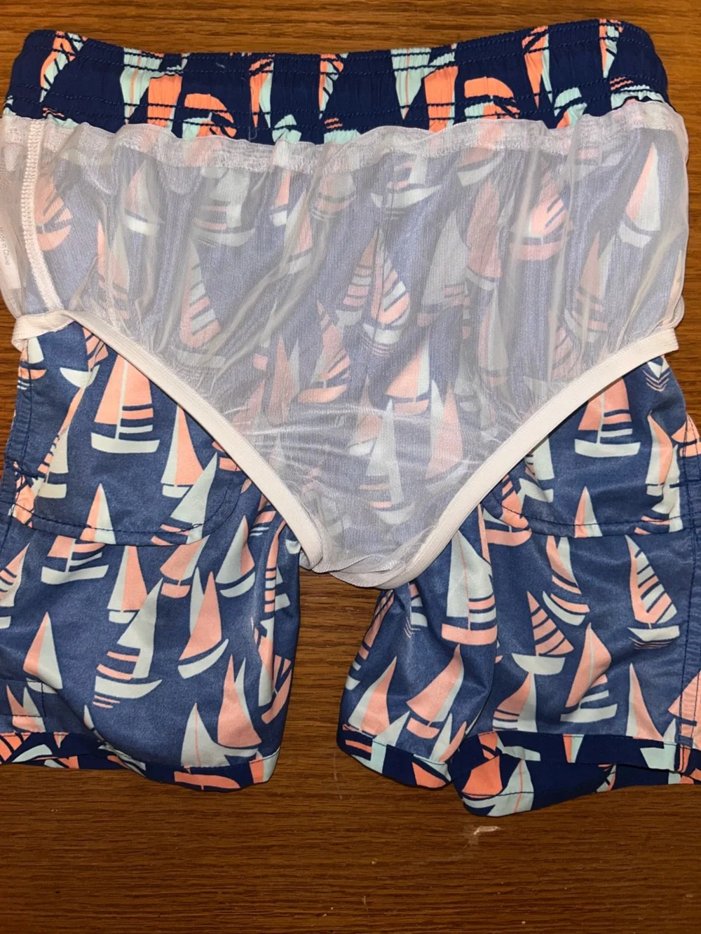 Boys Tom & Teddy Navy Swim Trunks with Coral and Light Blue Sailboat Motif
